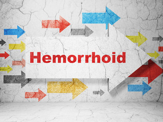 Health concept: arrow with Hemorrhoid on grunge wall background