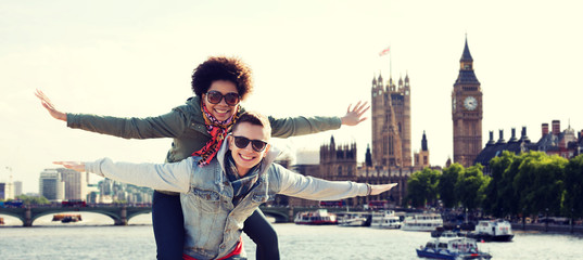 happy teenage couple having fun over london city