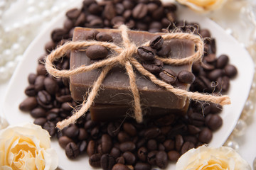 Composition with grains of coffee, soap and decorative objects