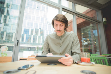 Young handsome caucasian man with moustache