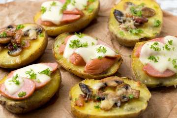 baked potato with mushrooms, bacon, sausage and with cheese moza - obrazy, fototapety, plakaty