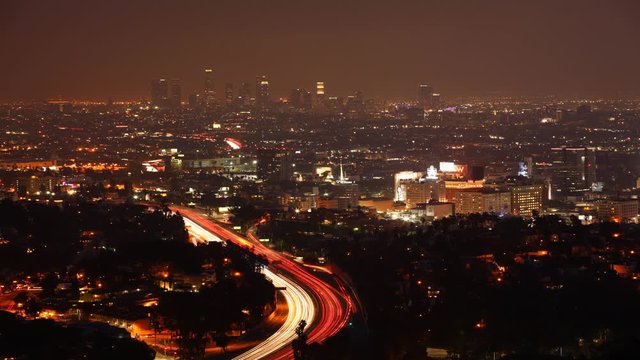 4K UltraHD A timelapse view over Los Angeles at night with the lights of expressway traffic