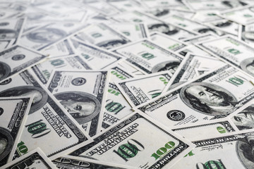 Fake money background. Business background. One hundred dollar bills. Shallow depth of field. Selective focus.