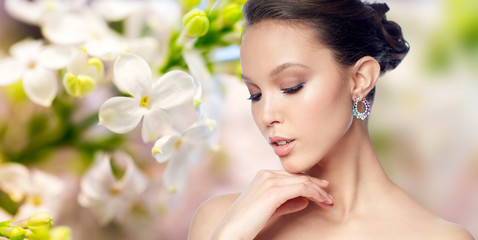 Fototapeta premium close up of beautiful woman face with earring
