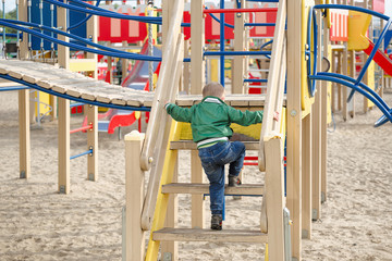 Fototapeta na wymiar children play on the playground. early spring