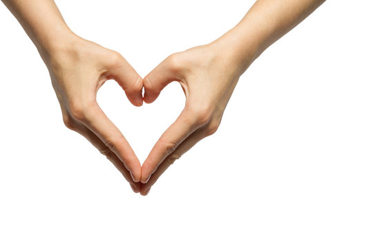 girl's hands serried in a heart shape on isolated background