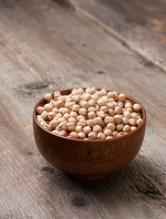 dry chickpeas in a wooden bowl