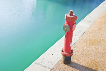 Red fire hydrant on gravel quay - image with copy space