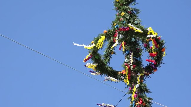 maypole in front of blue sky
