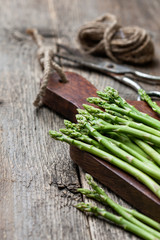 fresh asparagus on a cutting board