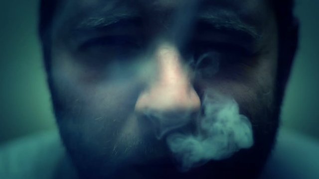 Man smoking close up 
