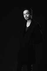 Fototapeta premium Portrait of beautiful sexy man in the studio. black and white.