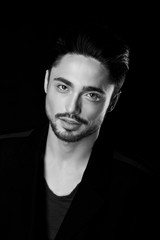 Portrait of beautiful sexy man in the studio. black and white.