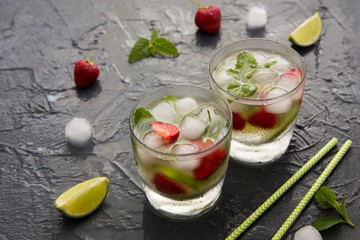 Refreshing summer cocktail with lime, strawberry and mint. Mojit