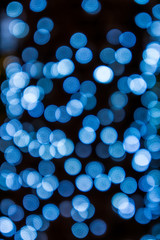 Abstract blue bokeh light isolated with black  background. It is used for background and pattern.