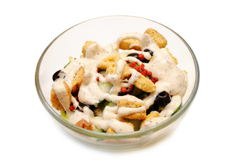 A Bowl of Fresh Salad with Creamy Dressing