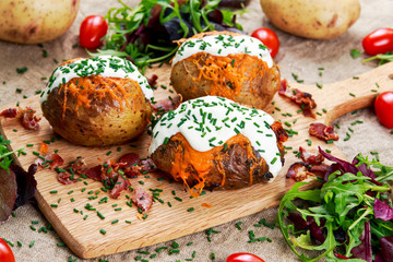 Hot Baked Potato with cheese, bacon, chives and sour cream.