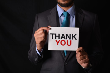 Professional Holding a Thank you Sign in hands