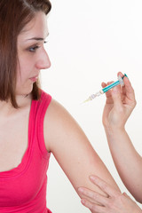 Female doctor doing vaccine her patient on arm