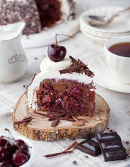 Black forest cake ,decorated with whipped cream and cherries Schwarzwald pie, dark chocolate and cherry dessert