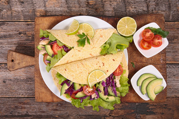fajita with vegetable on board