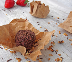 Still life of broken chocolate bar  on wooden table