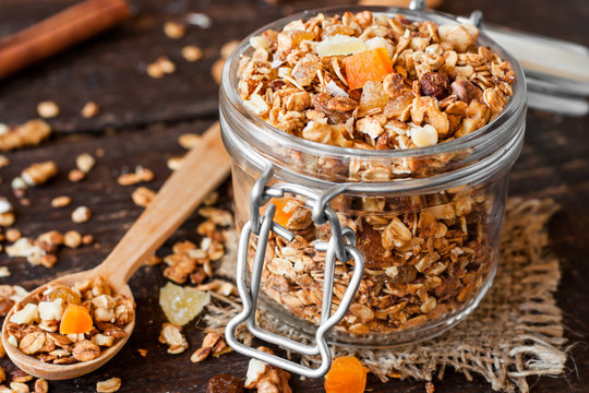 homemade granola with nuts and dried fruit in a glass jar
