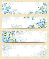 Set of four vector web banners with blue forget-me-not flowers.
