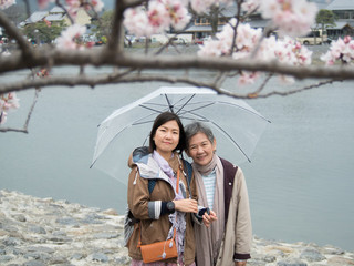Senior mother and daughter with umbrella at Nishikyo-ku, Kyoto, Japan