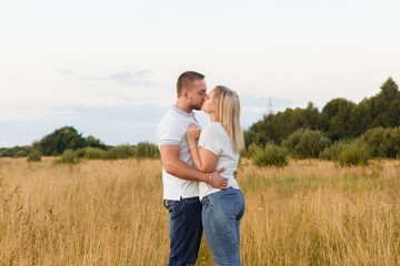Couple in love in a field of grass