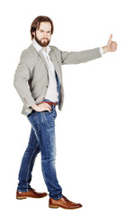 Naklejka premium usinessman looking at camera and showing his thumb up while stan