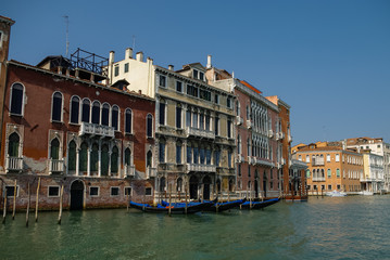 Fototapeta na wymiar Gondolas and beautiful classical buildings on the Grand Canal, Venice, Italy