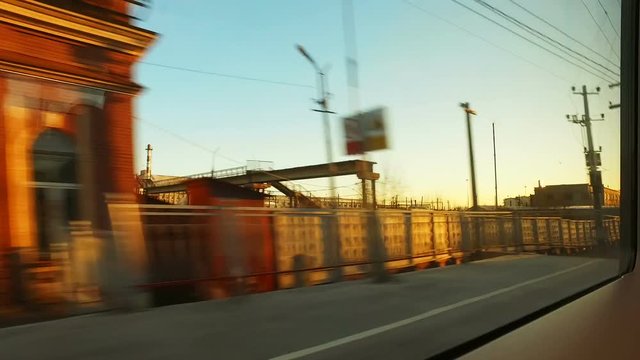 landscape outside the window by during train trip at spring day