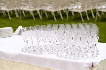 Glasses of champagne on a tray in the hands of a waiter at the w