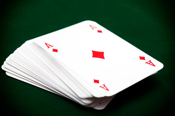 Deck of cards with ace of diamond on top