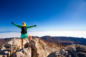 Woman climbing success in mountain top