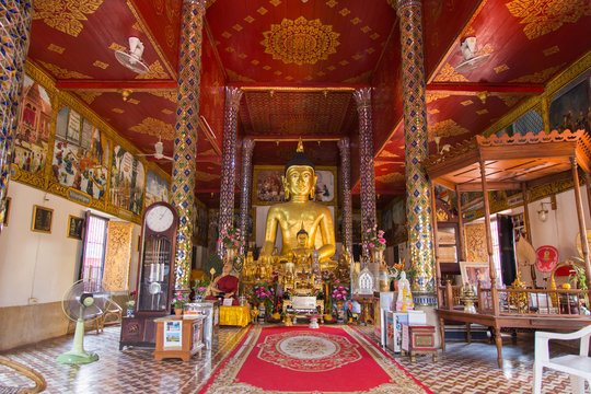Golden buddha statue at Temple Phra That Hariphunchai in Lamphun, Province Lamphun, Thailand.
