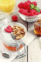 Overnight chia seeds pudding with pumpkin puree in glass jar. Healthy breakfast to go. Superfoods concept