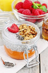 Overnight chia seeds pudding with pumpkin puree in glass jar. Healthy breakfast to go. Superfoods concept