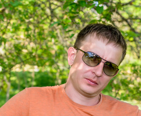 Handsome serious man in trendy sunglasses