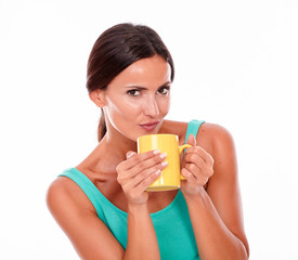 Pouting brunette woman with coffee mug
