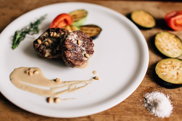 grilled meat with vegetables and cedars