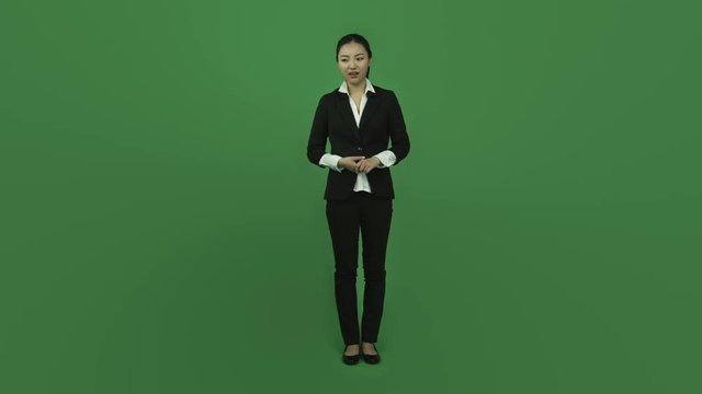 Asian business woman isolated greenscreen green background interview talking upset