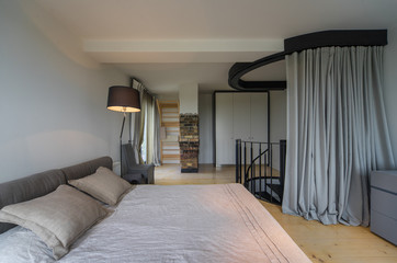 Bedroom in a modern house. Modern interior in private flat.