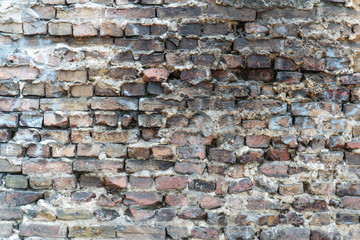old dirty and grainy brick stone city underground wall with all kind of different color textures urban style background