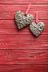 Love hearts on a red wooden background