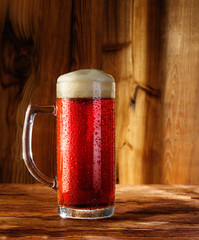 cherry beer on a wooden background