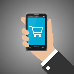 Hand holding smartphone with shopping cart icon