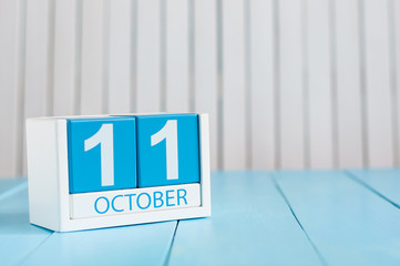 October 11th. Image of October 11 wooden color calendar on white background. Autumn day. Empty space for text