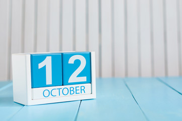 October 12th. Image of October 12 wooden color calendar on white background. Autumn day. Empty space for text